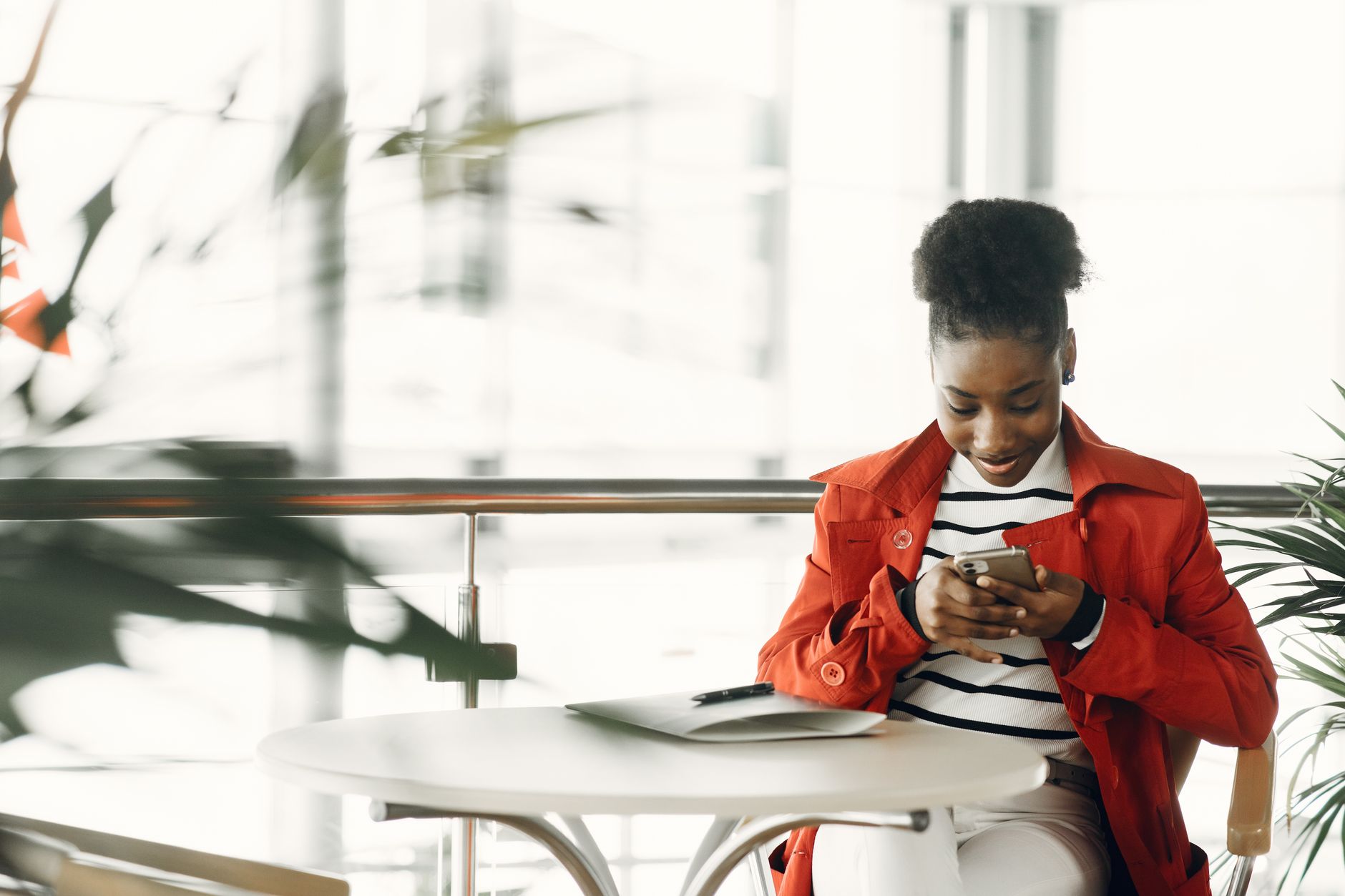 Person checking a deletion confirmation email on a smartphone with a calm expression at home.